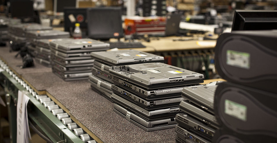 Stacks of returned laptops in audit